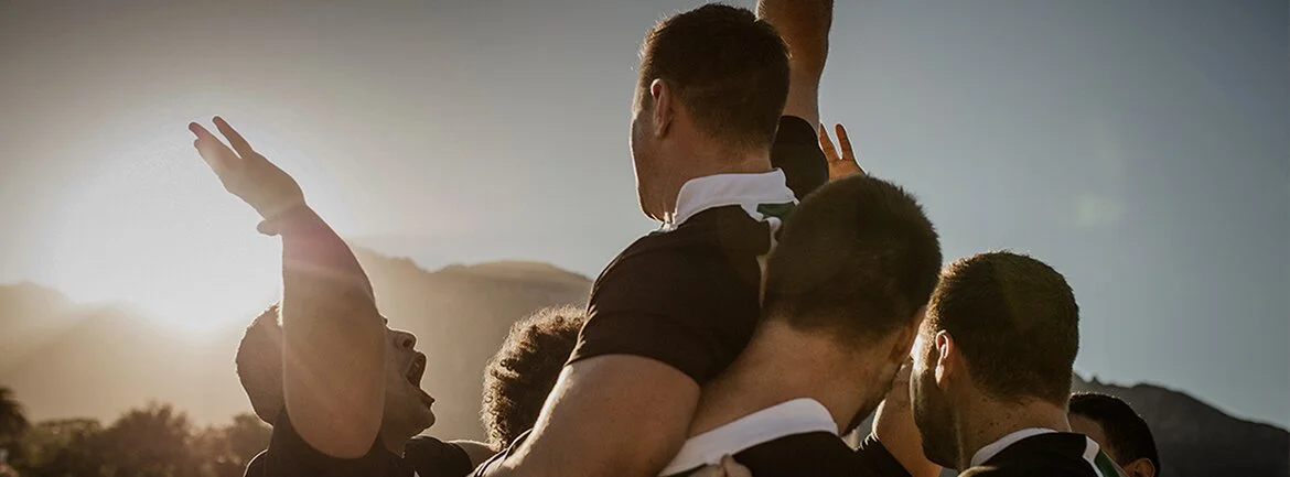 a group of people in suits